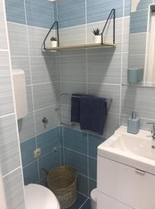 a bathroom with a toilet and a sink at Apartment Portorose in Portorož