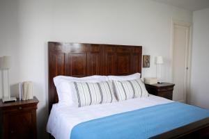 A bed or beds in a room at IseoLakeRental - La Stallina - Monte Isola