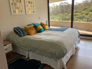 Ένα ή περισσότερα κρεβάτια σε δωμάτιο στο Costa Puyai II Departamento 5 piso