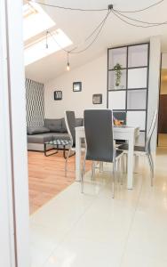 a living room with a white table and chairs at EASY RENT Apartments - LOFT, Centrum 24h Check-in in Lublin