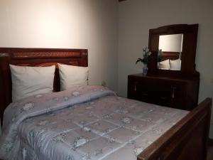 Posteľ alebo postele v izbe v ubytovaní Dinas House Tuscany Holidays