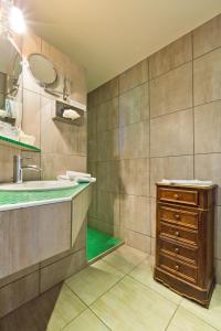 a bathroom with a sink and a mirror at Relais d'Auvergne in Saint-Gervais-dʼAuvergne