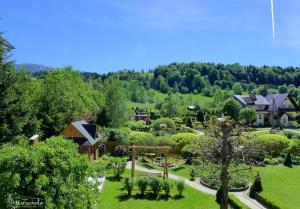 an aerial view of a garden with trees and houses at Willa Modrysówka in Zawoja