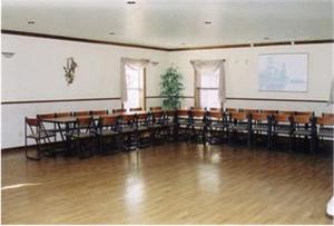 a large room with tables and chairs in it at Silver Spruce Inn in Glenwood Springs