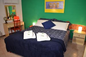 Postel nebo postele na pokoji v ubytování Dimora Le Colline