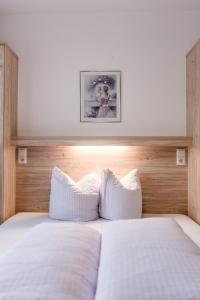 En eller flere senge i et værelse på Appartement Grüner Fidelis