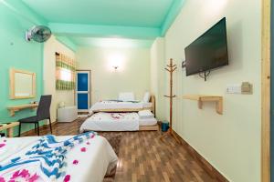 Letto o letti in una camera di Olhumathi View Inn