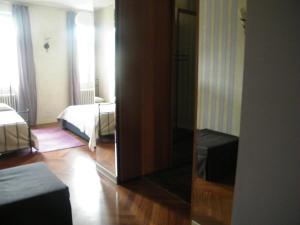 Un pat sau paturi într-o cameră la Villa Franca Casa Vacanze