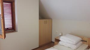 Postel nebo postele na pokoji v ubytování Tiszai Vándor Apartmanház