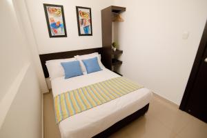 Voodi või voodid majutusasutuse Hotel Maranata Valledupar toas