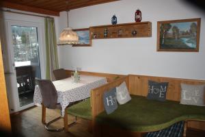 a dining room with a table and a table and chairs at Zagglhaus in Scheffau am Wilden Kaiser