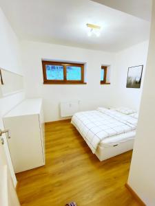 Postel nebo postele na pokoji v ubytování Mezonetový apartmán ve skandinávském stylu