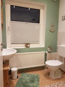 Koupelna v ubytování Ferienwohnung in Osterdeichstrich