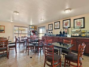 a restaurant with tables and chairs and a bar at The Inn at Market Square in San Antonio