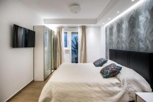 Postel nebo postele na pokoji v ubytování Dubrovnik Spectrum Rooms