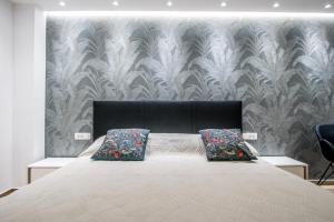 Postel nebo postele na pokoji v ubytování Dubrovnik Spectrum Rooms