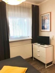 Telewizja i/lub zestaw kina domowego w obiekcie Südhang FeWo