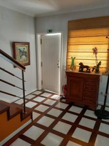 a room with a staircase and aoyer with a floor at Casa Júnior in Arouca