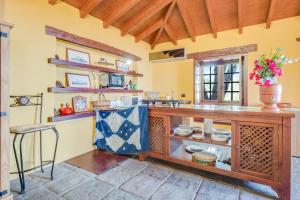 a kitchen with a counter with dishes on it at Finca el Rincón in Arona