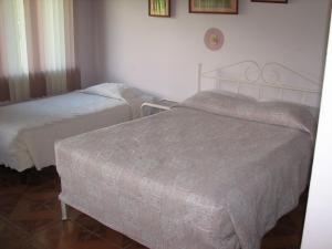 Postel nebo postele na pokoji v ubytování Hotel La Arena
