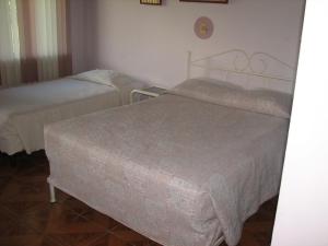 Postel nebo postele na pokoji v ubytování Hotel La Arena
