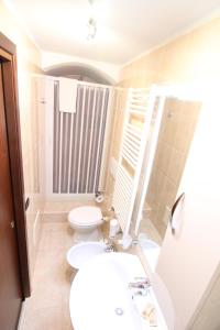 a bathroom with a toilet and a sink at Il Balcone di Giulietta in Locorotondo +17 photos