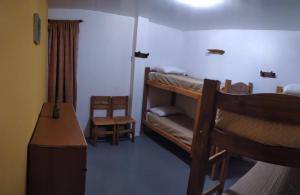 Una cama o camas cuchetas en una habitación  de ALMA Travelers