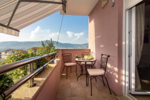 a balcony with a table and chairs and a view at Utopia apartments Split in Split