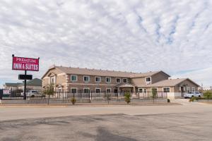 a building with a sign that reads research inn suites at Premium Inn and Suites in Killeen