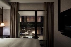 Rúm í herbergi á Tango Inn Taipei ZhongShan