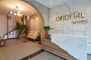 a lobby with an entrance to a dental clinic at Oriental Danang in Da Nang