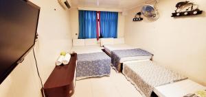 Un pat sau paturi într-o cameră la New hoover hostel