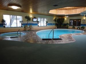 a large swimming pool in a hotel room at Canway Inn & Suites in Dauphin