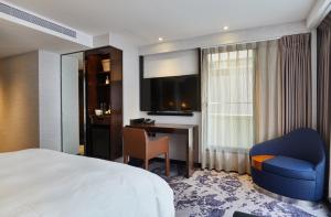 Rúm í herbergi á Tango Inn Taipei ZhongShan