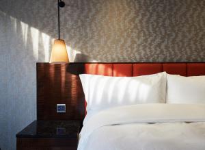 Rúm í herbergi á Tango Inn Taipei ZhongShan