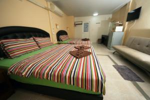 Postel nebo postele na pokoji v ubytování Pineapple Guesthouse
