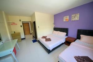 Postel nebo postele na pokoji v ubytování Pineapple Guesthouse