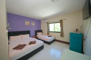 Postel nebo postele na pokoji v ubytování Pineapple Guesthouse