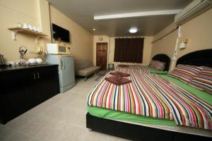 Postel nebo postele na pokoji v ubytování Pineapple Guesthouse