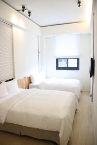 Postel nebo postele na pokoji v ubytování Home Rest Hotel 2