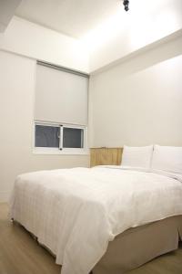 Postel nebo postele na pokoji v ubytování Home Rest Hotel 2