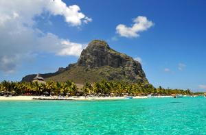 a view of a beach with a mountain in the background at Sun Villa in Pereybere