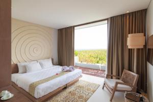Postel nebo postele na pokoji v ubytování Svarga Resort Lombok