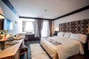 Postel nebo postele na pokoji v ubytování Hotel Grifone
