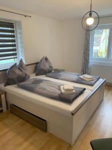 a bedroom with a large bed in a room at Seerestaurant & Suiten Hayat in Steindorf am Ossiacher See