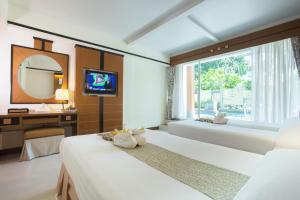 Postel nebo postele na pokoji v ubytování Asia Cha-am Hotel