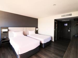 Katil atau katil-katil dalam bilik di Fortune View Khong Hotel Nakhon Phanom