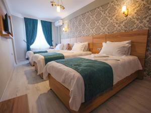Ліжко або ліжка в номері acar hotel Kırıkkale