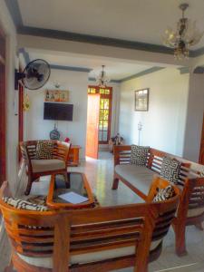 a living room with a couch and a table at Jaya Tomodachi in Kandy