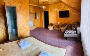 a view of a room in a wooden cabin at Pid Yavorom in Ivano-Frankivsk